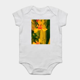 Yellow red lily blossom on yellow background Baby Bodysuit